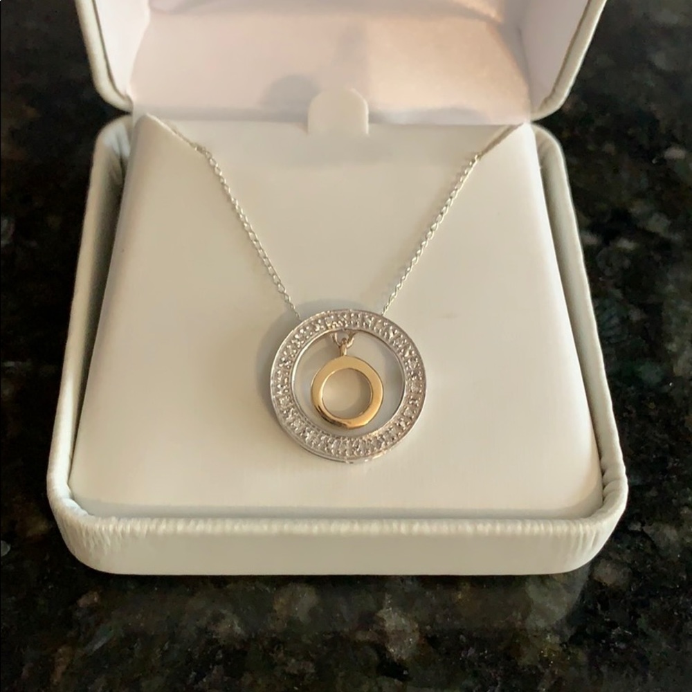 Silver, yellow gold and diamond accent pendent